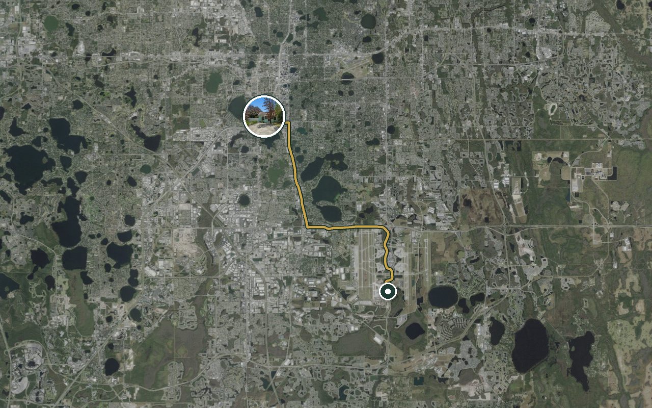 Satellite map showing Fruit Tree Home, our nearest home, and the driving route to Orlando International Airport, about 26 minutes by car.