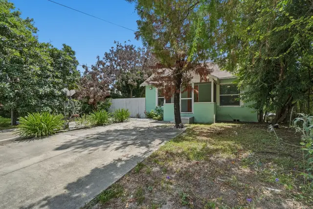 Charming tree-shaded home with private driveway and peaceful front yard at Fruit Tree Home