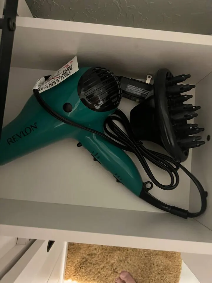 Hair blow dryer in master bedroom at Fruit Tree Home