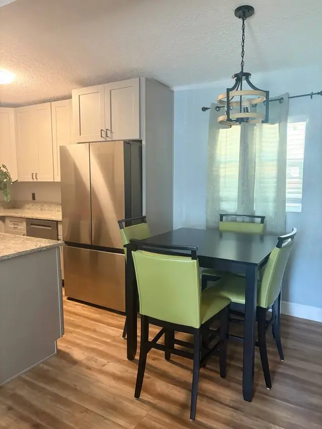 Bright dining nook with stylish seating beside the modern kitchen at Amelia’s Arena Retreat