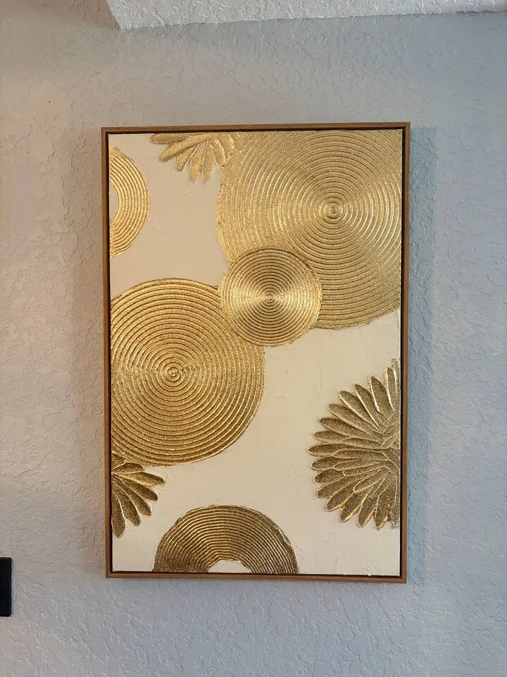 Elegant gold wall art adds a warm, modern designer touch at Amelia’s Arena Retreat