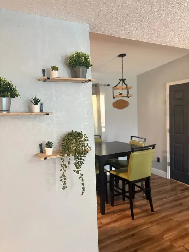 Bright modern dining area with stylish decor and warm natural light at Amelia’s Arena Retreat
