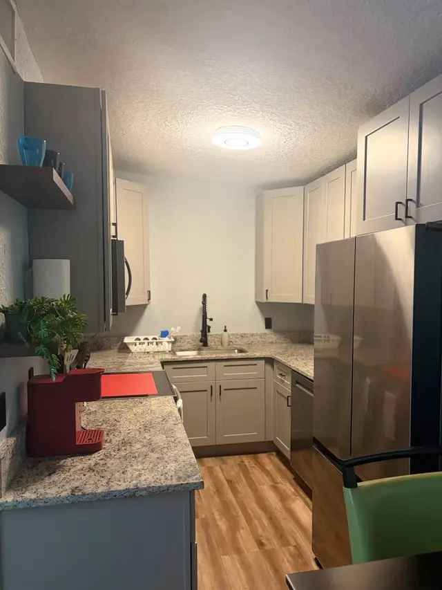 Modern kitchen with stainless appliances and stylish finishes at Amelia’s Arena Retreat