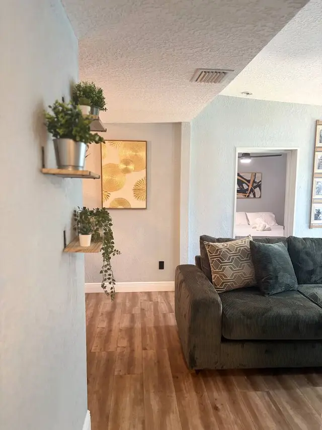 Cozy living area with warm floors, stylish decor, and inviting comfort at Amelia’s Arena Retreat