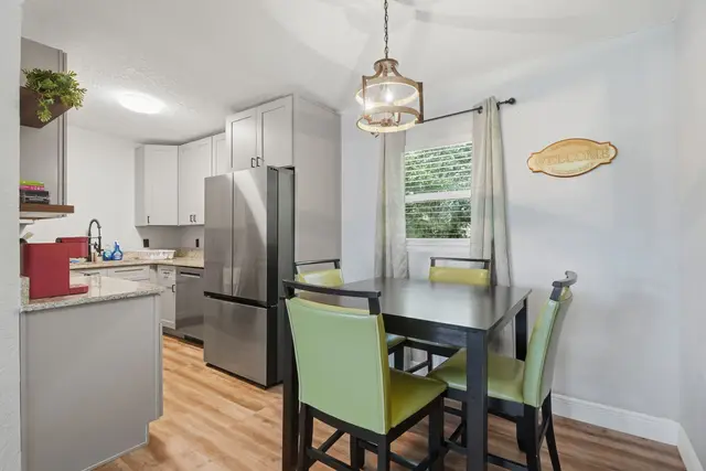Bright kitchen and dining space with seating for 4 and modern finishes at Amelia’s Arena Retreat