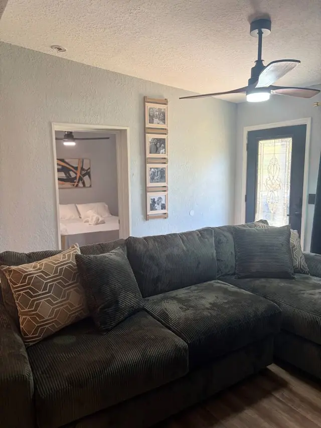 Cozy living room with oversized sectional and modern touches at Amelia’s Arena Retreat