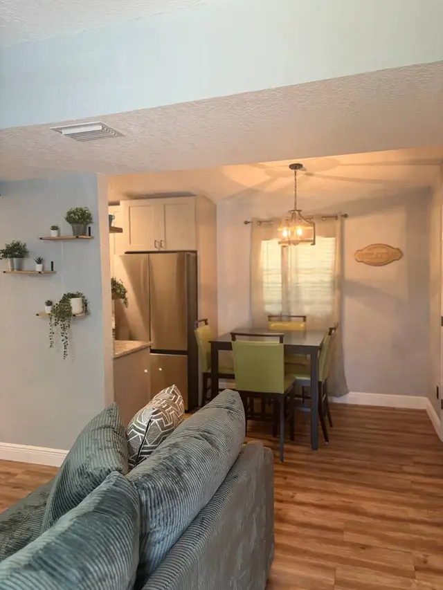 Cozy open dining space with warm lighting and stylish modern touches at Amelia’s Arena Retreat