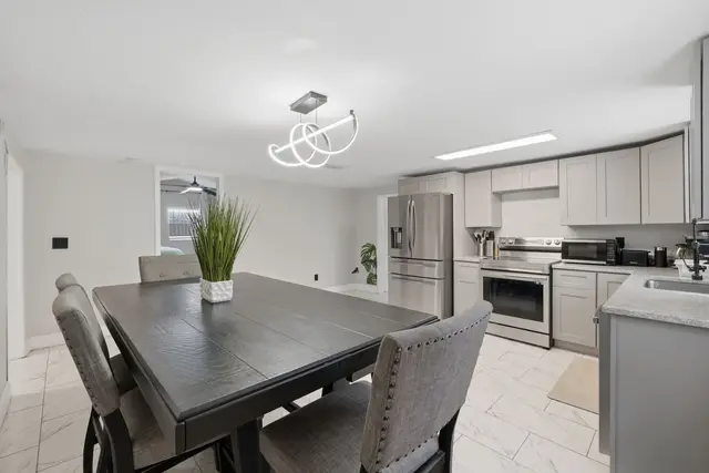 Bright modern kitchen and dining area with stylish finishes at Piedmont