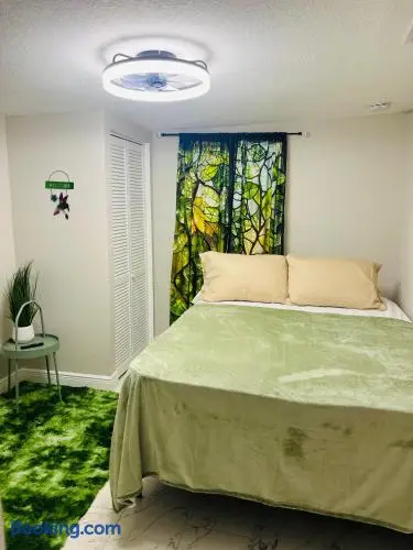Cozy nature-inspired bedroom with plush bedding and calming green accents at Piedmont