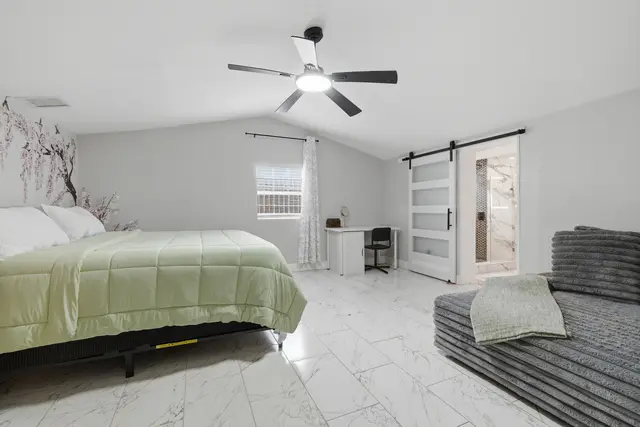 Spacious, light-filled bedroom with vaulted ceilings and modern style at Piedmont