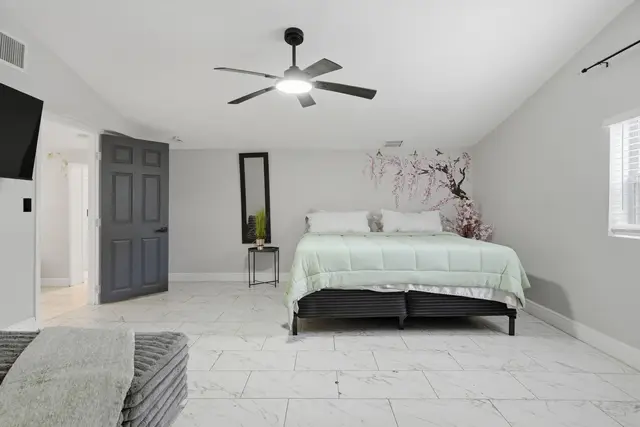 Bright, spacious king bedroom with vaulted ceilings and modern style at Piedmont
