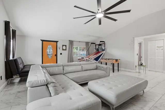 Spacious lounge with sectional seating and fun game room features at Piedmont