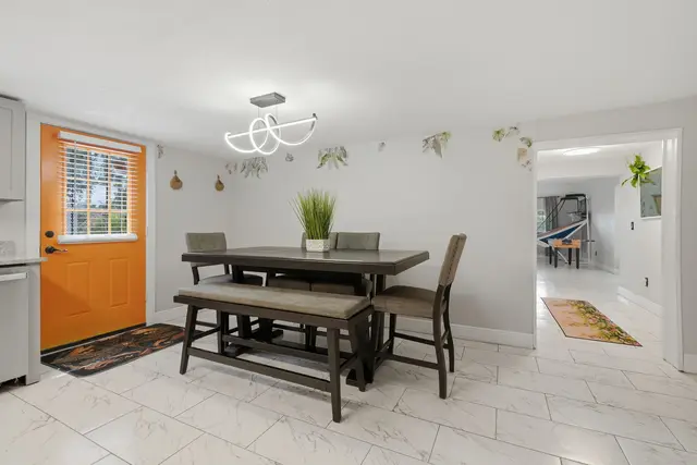 Bright dining area with stylish seating and a cheerful pop of color at Piedmont