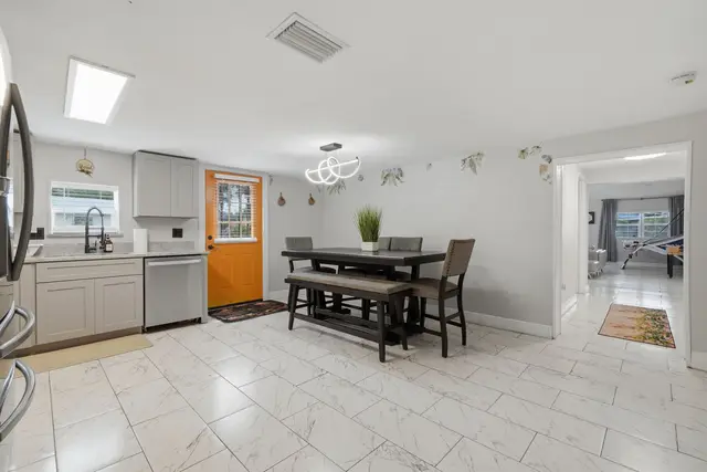 Bright dining area with modern kitchen and easy flow to game room at Piedmont