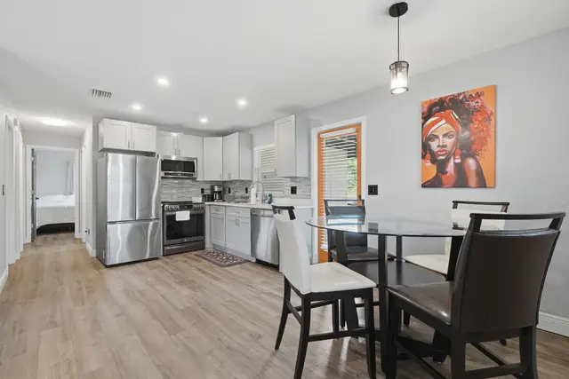 Modern kitchen and dining space with stylish finishes and bright natural light at WinterPark Home