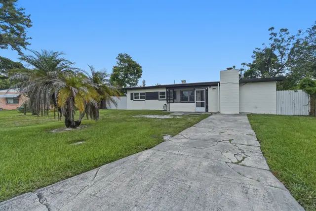 Bright single-story home with private driveway and spacious yard at The Clue House