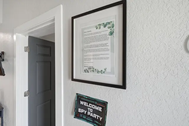 Welcoming entry detail with framed guest guide and stylish decor at The Clue House