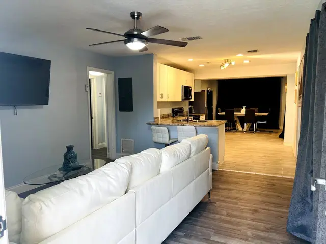 Open concept as you enter property- Living Room, Kitchen and Dining Area at Entertainment Home